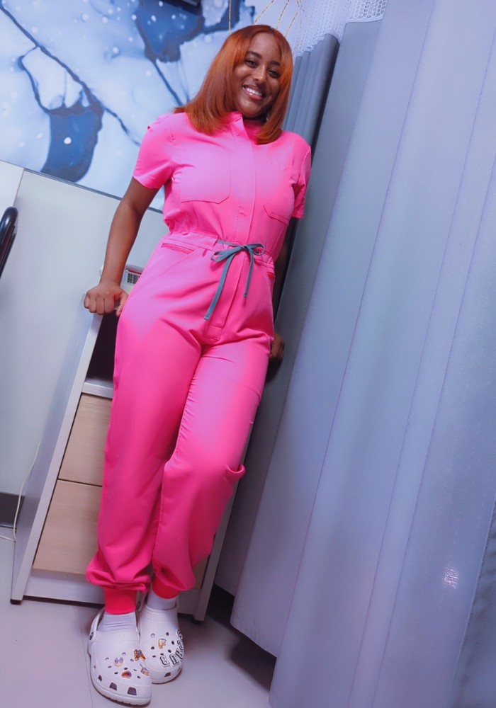 Bubblegum pink scrub romper with ribbed bottom for women, medical uniform jumpsuit